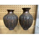 A PAIR OF COPPER BALUSTER VASES DECORATED WITH PANELS OF PERSIAN FIGURES