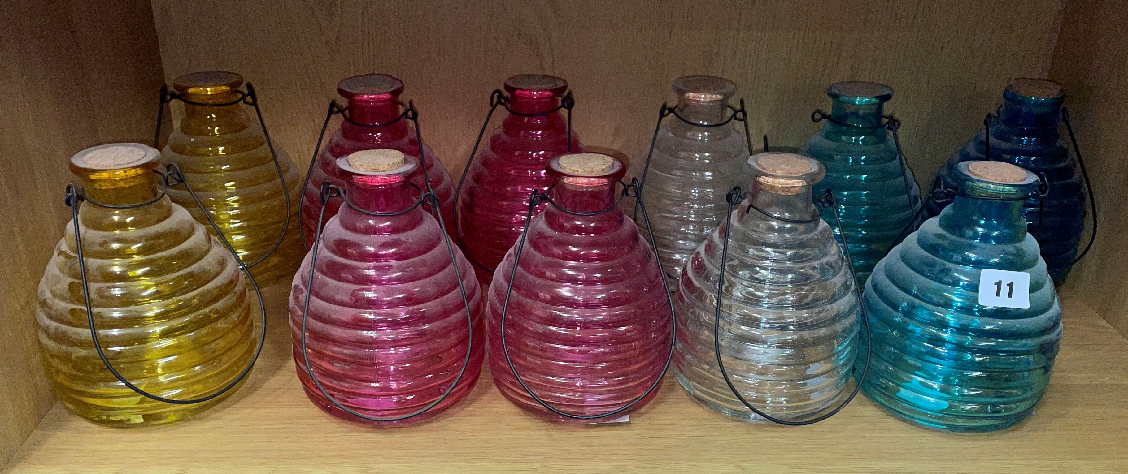 SHELF OF FIVE PAIRS PLUS ONE OTHER RIBBED HANGING WASP TRAP JARS H-18CM