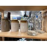 TWO GLASS BREWING JARS AND THREE STONEWARE POTS