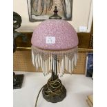 ART NOUVEAU STYLE TABLE LAMP WITH MOTTLED PINK GLASS SHADE AND BEADED FRINGE 44CM H