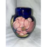 MOORCROFT POTTERY 'PINK MAGNOLIA' OVOID GINGER JAR AND COVER ON BLUE GROUND 11CM H