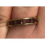 9CT GOLD RUBY CHANNEL SET BAND SIZE O, 2.