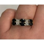 9CT GOLD SIX STONE SAPPHIRE AND DIAMOND CHIP RING SIZE O, 3.