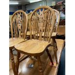 SET OF SIX ELM AND BEECH WHEEL BACK DINING CHAIRS INCLUDING TWO ELBOW CHAIRS 90CM H