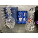 TUTBURY AND STAFFORDSHIRE CRYSTAL DECANTERS WITH BOXES AND A MINIATURE DECANTER AND TUMBLER SET