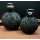 PAIR OF CARVED WOODEN INDIAN MATKA POTS AND COVERS WITH IRON JAALI CHAIN WORK JACKETS