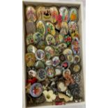 TRAY OF NEEDLE POINT EMBROIDERED AND CERAMIC BROOCHES,