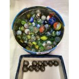 TIN OF GLASS MARBLES AND DOUBLES