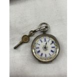 935 CONTINENTAL WHITE METAL CASED FOB WATCH WITH AN ENAMEL DIAL,