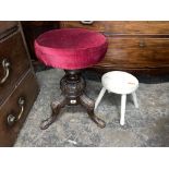 VICTORIAN CARVED WALNUT REVOLVING PIANO STOOL AND A PRIMITIVE MILKING STOOL