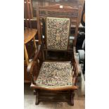 LATE 19TH CENTURY WALNUT UPHOLSTERED COLONIAL TYPE ROCKING ARMCHAIR