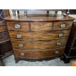 GEORGE III MAHOGANY BOW FRONTED AND BOX LINE INLAID CHEST OF THREE OVER THREE DRAWERS ON SPLAY