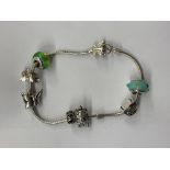 MODERN BRACELET WITH SILVER WHITE METAL AND GLASS BEAD CHARMS