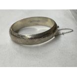 SILVER ENGRAVED BANGLE WITH SAFETY CHAIN