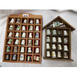 TWO COMPARTMENTED RACKS OF CERAMIC AND OTHER THIMBLES