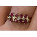 9K YELLOW GOLD RUBY AND DIAMOND DRESS RING 2.