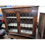 OAK CARVED AND LEADED GLAZED CABINET