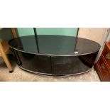 CONTEMPORARY BLACK GLASS OVAL TV MEDIA CABINET H- 41CM W- 115CM D- 47CM