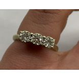 9CT WHITE GOLD AND THREE STONE ROUND BRILLIANT CUT DIAMOND RING (0.