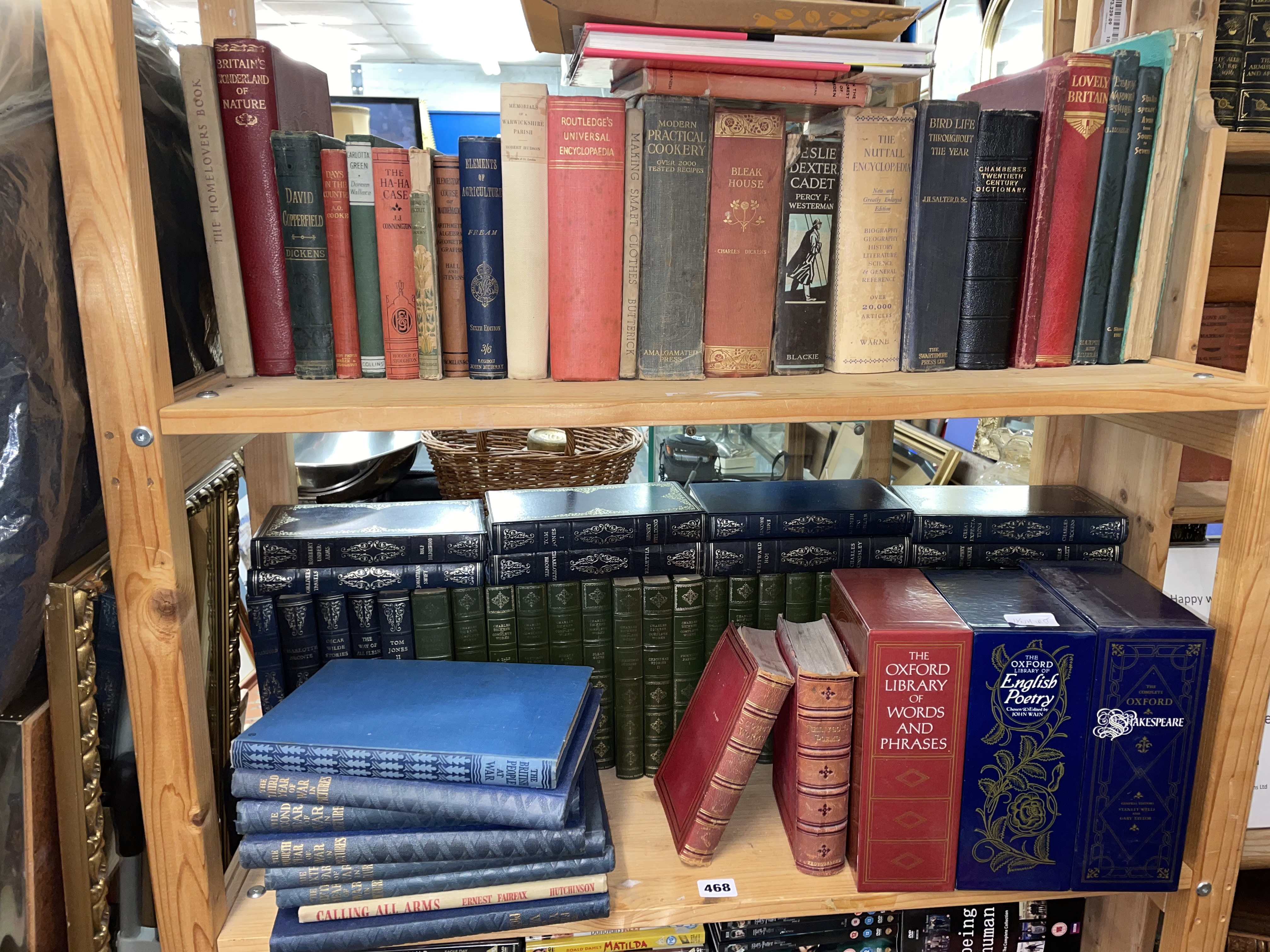 TWO SHELVES OF BOOKS INCLUDING THE OXFORD LIBRARY, CHARLES DICKENS AND ASSORTED NOVELS,