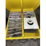 YELLOW CARRY CASE CONTAINING A SELECTION OF 45 RECORDS
