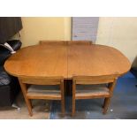 1970S NISSEN DANISH TEAK EXTENDING DINING TABLE AND FOUR FABRIC UPHOLSTERED CHAIRS