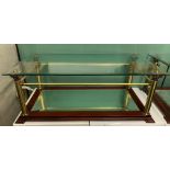 TWO GLASS TOPPED COFFEE TABLES WITH BRASS CORINTHIAN COLUMN SUPPORTS AND MIRRORED BASES