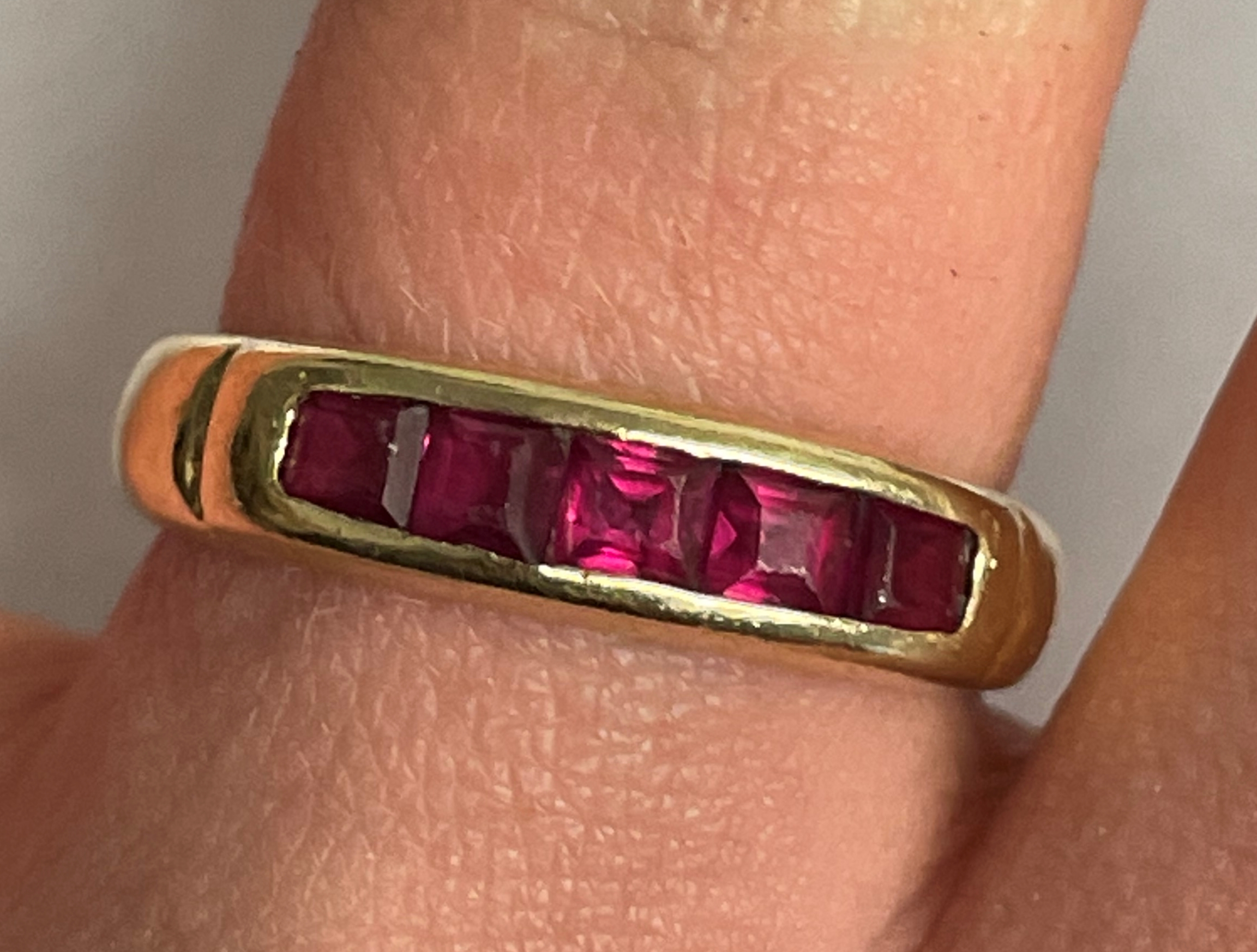 14K YELLOW GOLD CHANNEL SET RUBY RING STAMPED 585 3.8G APPROX.