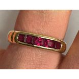 14K YELLOW GOLD CHANNEL SET RUBY RING STAMPED 585 3.8G APPROX.