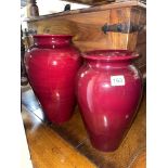 TWO MAROON BALUSTER POTTERY VASES