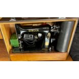 CASED SEWING MACHINE