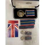 CASED NATIONAL SERVICE MEDAL AND ACCOMPANYING MINIATURE DRESS MEDAL