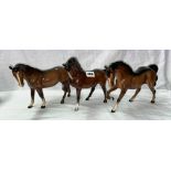 THREE BESWICK GLOSS PONIES (TWO PRANCING AND ONE OTHER)