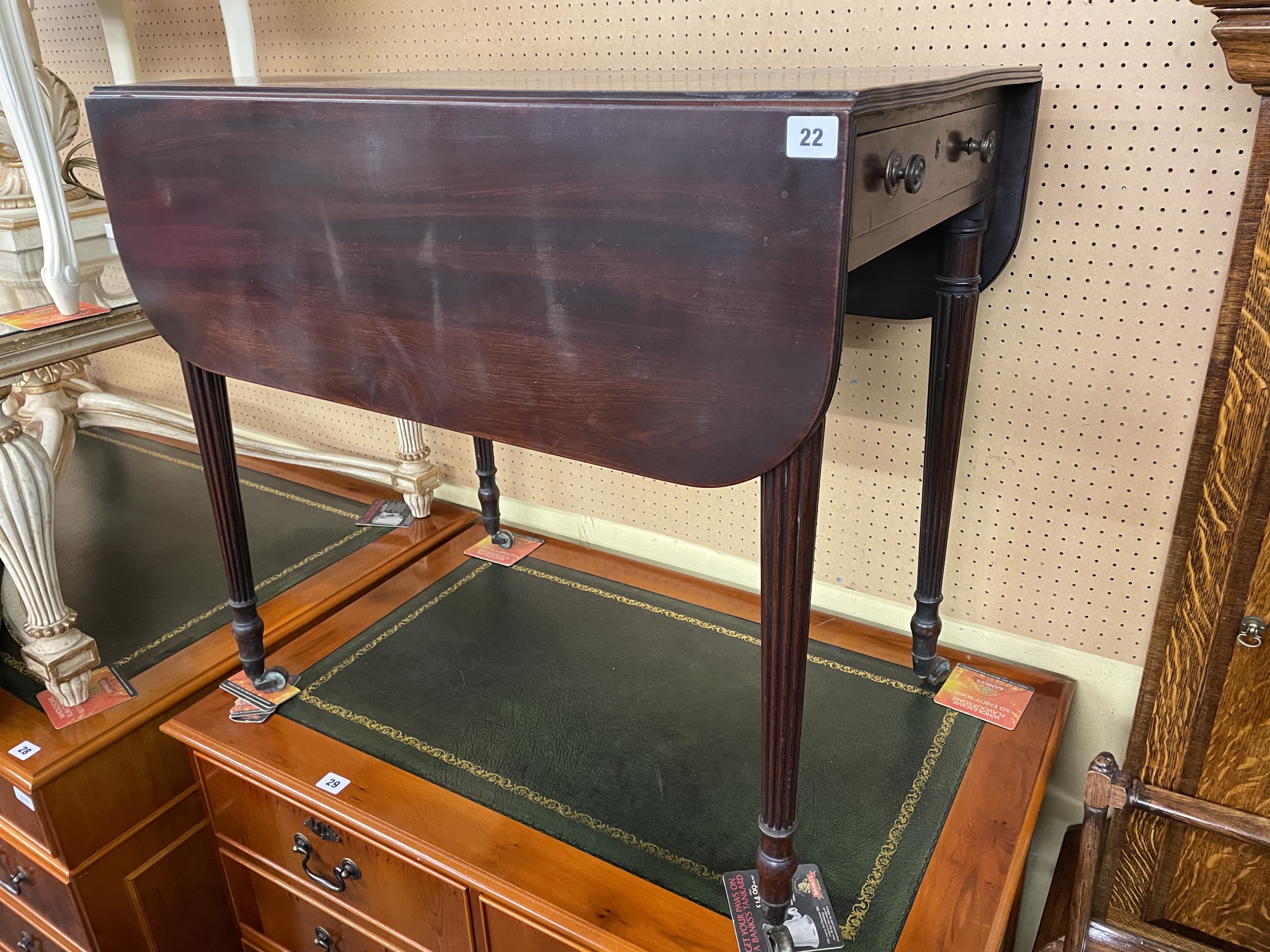 REGENCY MAHOGANY PEMBROKE TABLE ON FLUTED TAPERED LEGS WITH BRASS CAPS AND CASTORS