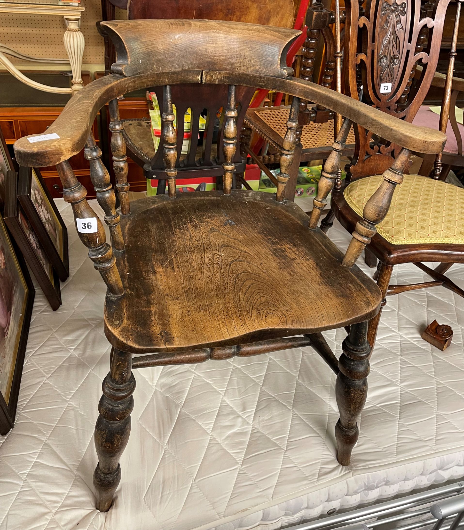 LATE 19TH CENTURY ELM SPINDLE RAIL SMOKERS BOW TYPE ARMCHAIR