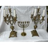 PAIR OF BRASS FIVE BRANCH CANDLEARBRUM AND A BRASS MENORAH
