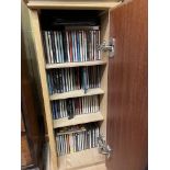 LIMED ASH PEDESTAL CD STORAGE CUPBOARD CONTAINING SELECTION OF CDS AND MINIATURE TEAK DROP FLAP