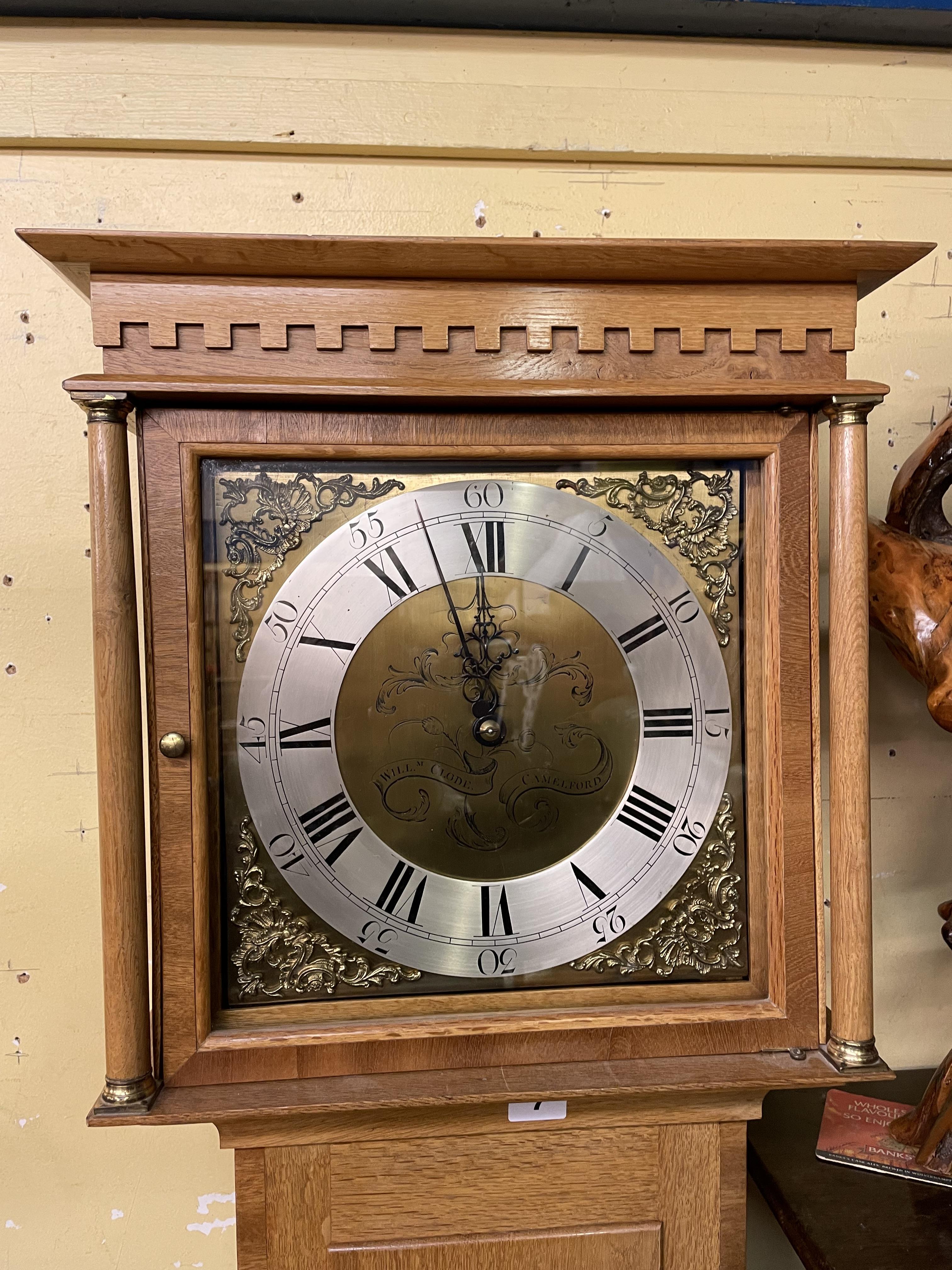 SMALL COTTAGE STYLE LONG CASE CLOCK IN A CONTEMPORARY OAK CROSS BANDED CASE WITH SQUARE DIAL SIGNED