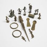 A group of 13 Akan Brass Artifacts including ten figural goldweights, two gold dust spoons and box,