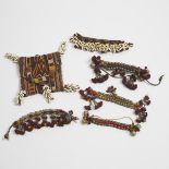 Group of Five Banjara Armlets together with a folding pouch, Goa, India, mid 20th century, largest a