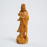 A Boxwood Figure of Guanyin, 20th Century, 二十世纪 黄杨木雕观音, height 11.9 in — 30.2 cm