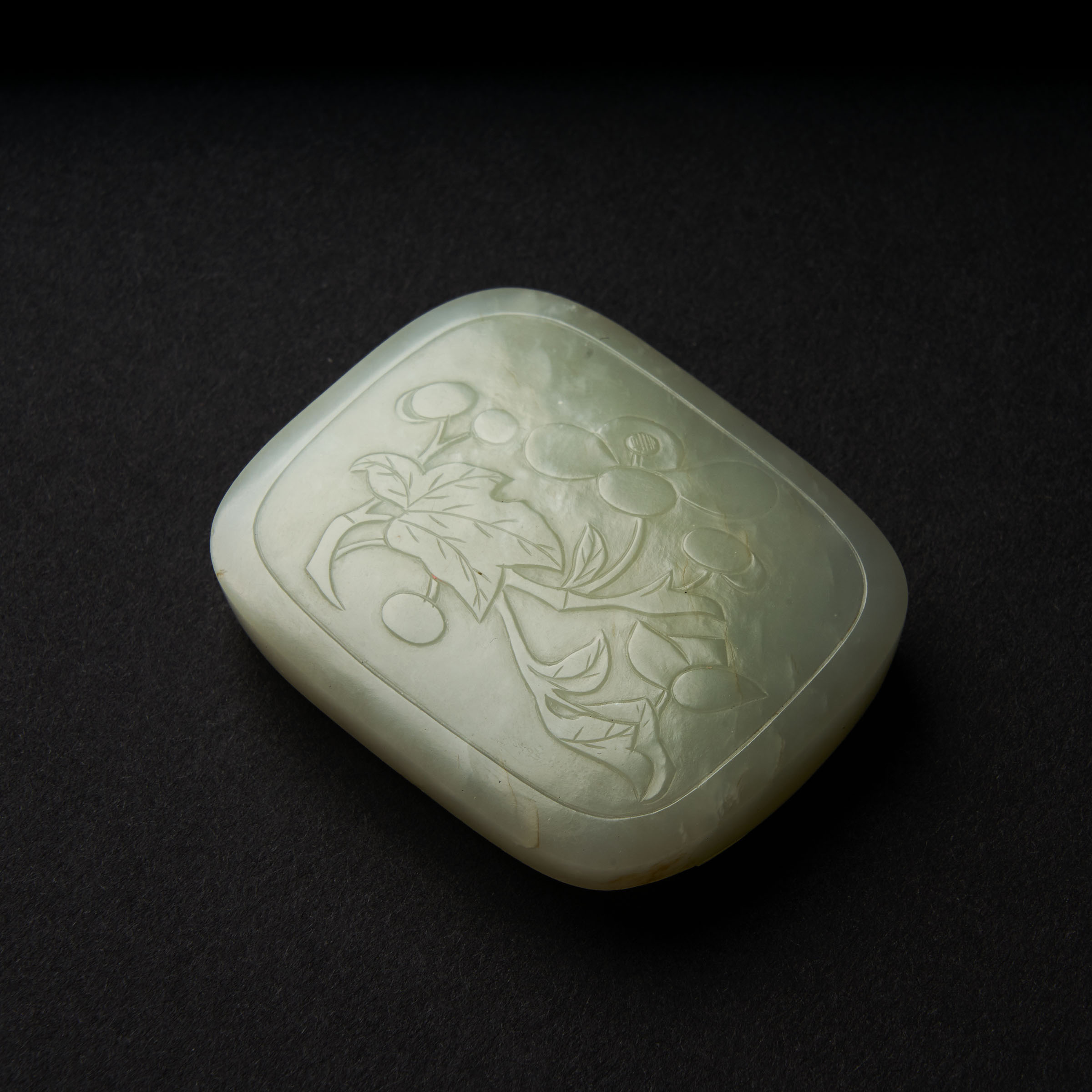 A White Jade 'Floral' Belt Buckle, Qing Dynasty, 19th Century, 清 十九世纪 白玉雕花卉兽面纹代扣, length 2 in — 5.2