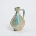 A Nishapur Turquoise-Glazed Pottery Jug, Iran, 12th/13th Century, height 7.1 in — 18 cm