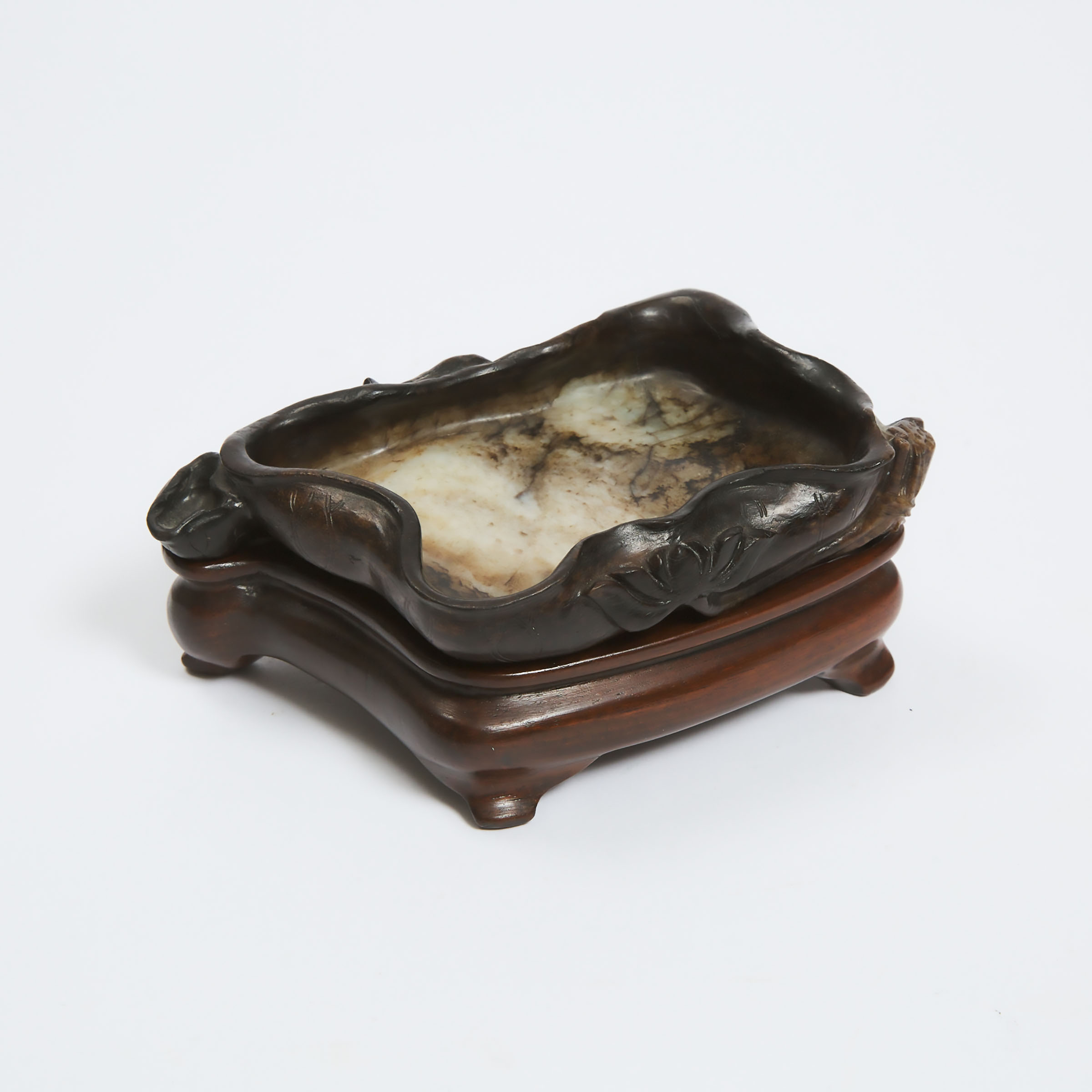 A Black, Beige and Russet Jade 'Lotus' Brush Washer, Ming Dynasty, 明 白玉提油荷叶形水洗, length 5.5 in — 13.9 - Image 2 of 5