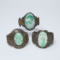 Three Chinese Silver Filigree 'Longevity' Bangles Inset with Carved Jadeite, Qing Dynasty, 19th Cent