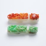 Two Jadeite 'Dragon' Belt Hooks, Qing Dynasty, 清 红翡及翡翠'苍龙教子'带钩一组两件, longest length 3.3 in — 8.5 cm (