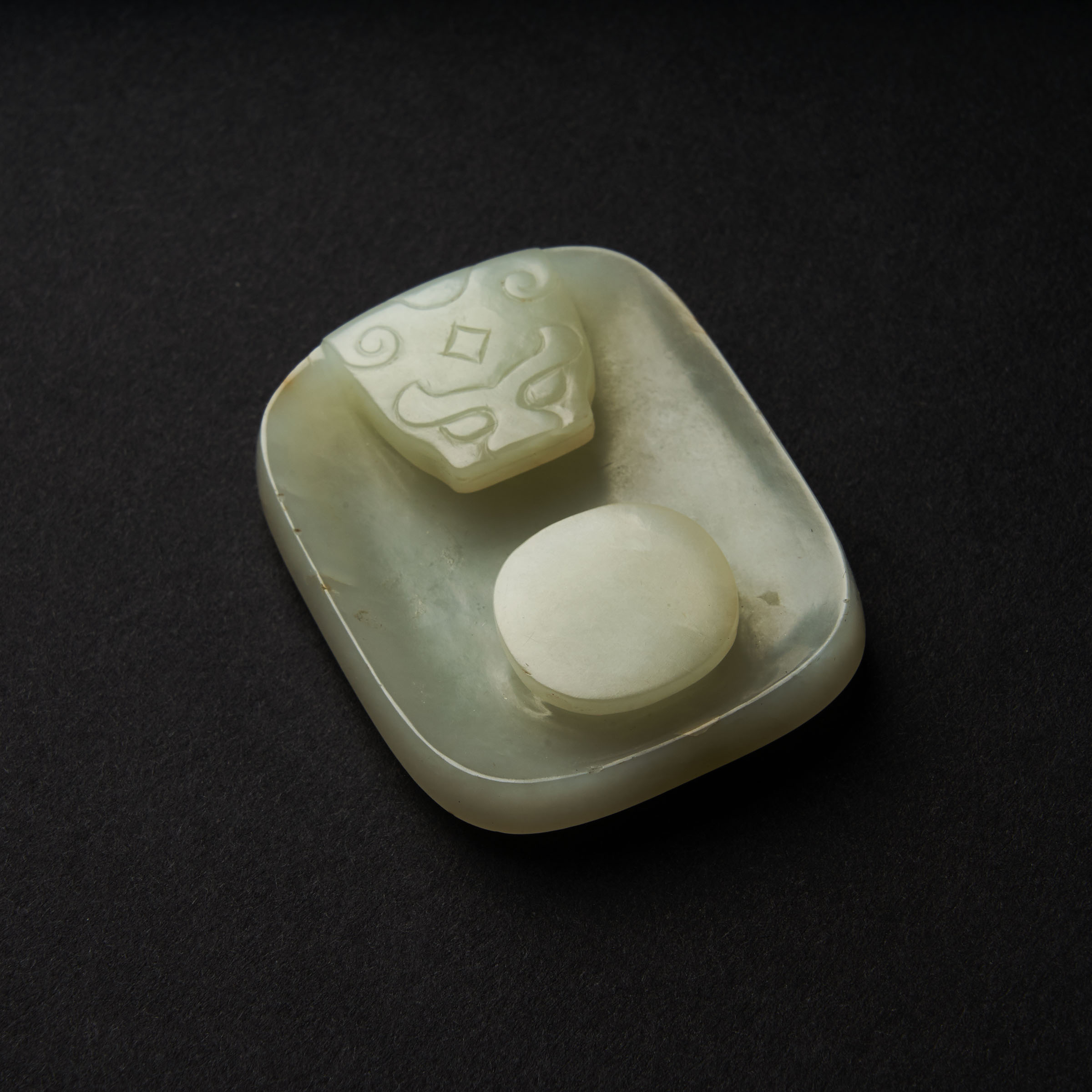 A White Jade 'Floral' Belt Buckle, Qing Dynasty, 19th Century, 清 十九世纪 白玉雕花卉兽面纹代扣, length 2 in — 5.2 - Image 2 of 2