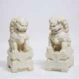 A Pair of Large Ming-Style Marble Buddhist Lions, Mid 20th Century, 建国初期 仿明汉白玉石狮一对, each 24 x 9.4 x