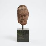 A Kushan/Mathura Red Sandstone Head of Buddha, Circa 2nd Century, overall height 12.2 in — 31 cm