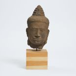 A Khmer Stone Head of Avalokiteshvara, Cambodia, 14th Century, including height 15 in — 38 cm
